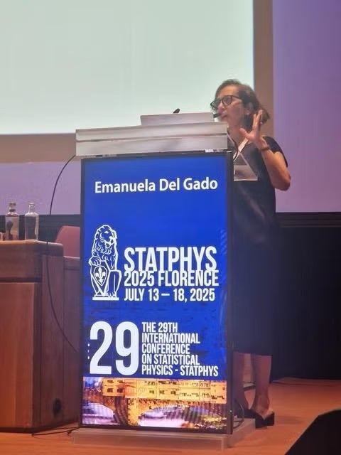 Prof. Emanuela Del Gado speaking behind podium for STATPHYS Conference 2025